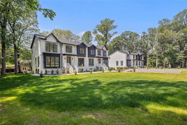 615 Union Rd, Spring Valley, NY 10977 - view of front of property with a front lawn and stucco siding