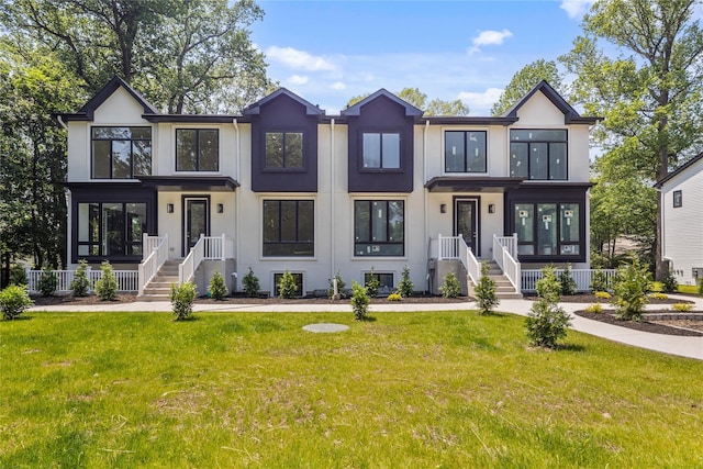 615 Union Rd, Spring Valley, NY 10977 - view of front of home featuring stucco siding and a front lawn