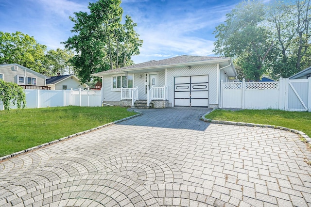8 Adolphi Pl, Ronkonkoma, NY 11779 - view of front facade with a gate, an attached garage, and decorative driveway