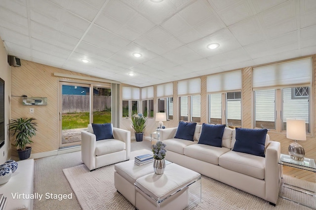 8 Adolphi Pl, Ronkonkoma, NY 11779 - living area featuring wooden walls, carpet, and recessed lighting