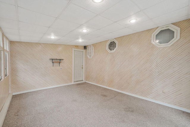 8 Adolphi Pl, Ronkonkoma, NY 11779 - basement featuring carpet floors, wooden walls, baseboards, recessed lighting, and a paneled ceiling