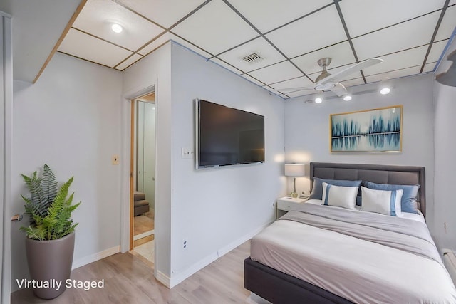 8 Adolphi Pl, Ronkonkoma, NY 11779 - bedroom featuring wood finished floors, a paneled ceiling, and baseboards