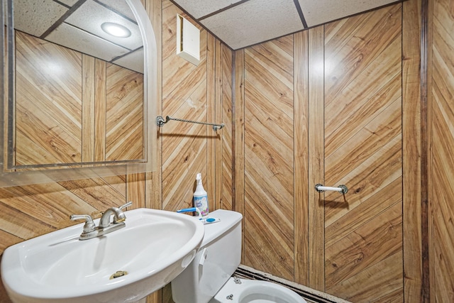 8 Adolphi Pl, Ronkonkoma, NY 11779 - half bath with a sink, wood walls, and toilet