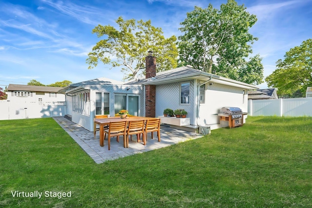 8 Adolphi Pl, Ronkonkoma, NY 11779 - back of house with a patio and a chimney