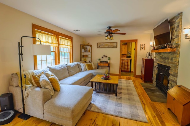470 Winding Hill Rd, Montgomery, NY 12549 - living room featuring a ceiling fan, wood finished floors, and a large fireplace