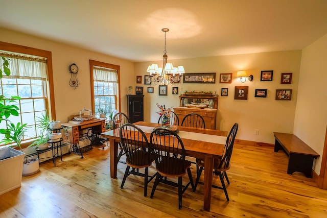 470 Winding Hill Rd, Montgomery, NY 12549 - dining space featuring a chandelier, light wood finished floors, and baseboards