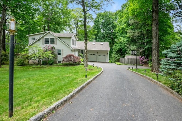 26 Mayberry Rd, Chappaqua, NY 10514 - traditional-style home featuring an attached garage, driveway, and view of scattered trees