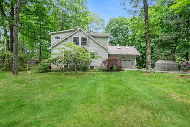 26 Mayberry Rd, Chappaqua, NY 10514 - view of front facade with a garage, asphalt driveway, and a front yard