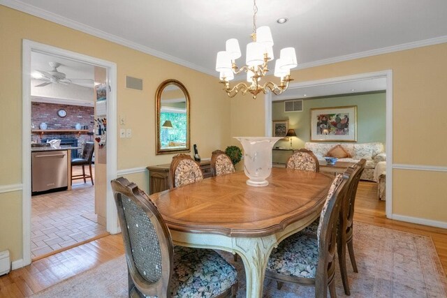 26 Mayberry Rd, Chappaqua, NY 10514 - dining space with a chandelier, crown molding, baseboards, light wood-type flooring, and a baseboard radiator