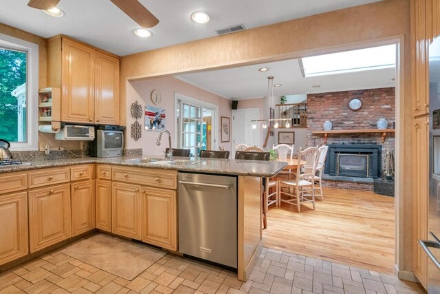 26 Mayberry Rd, Chappaqua, NY 10514 - kitchen with appliances with stainless steel finishes, a sink, a peninsula, and stone countertops