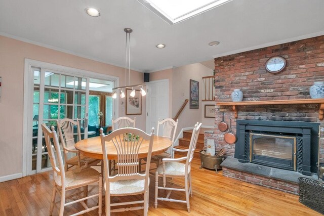 26 Mayberry Rd, Chappaqua, NY 10514 - dining area featuring wood finished floors, baseboards, a fireplace, ornamental molding, and recessed lighting