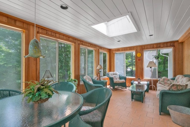 26 Mayberry Rd, Chappaqua, NY 10514 - sunroom / solarium with a skylight, wood walls, and tile patterned floors