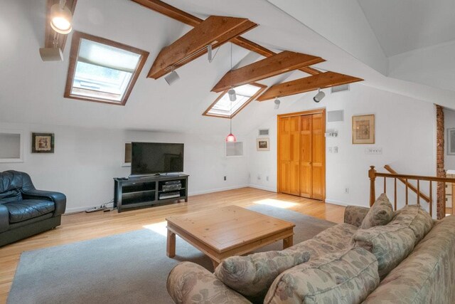 26 Mayberry Rd, Chappaqua, NY 10514 - living area with a skylight, light wood-style flooring, and baseboards