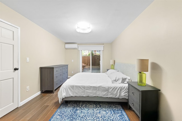 9965 Shore Rd Unit 6B, Brooklyn, NY 11209 - bedroom featuring a wall mounted air conditioner, wood finished floors, access to outside, and baseboards