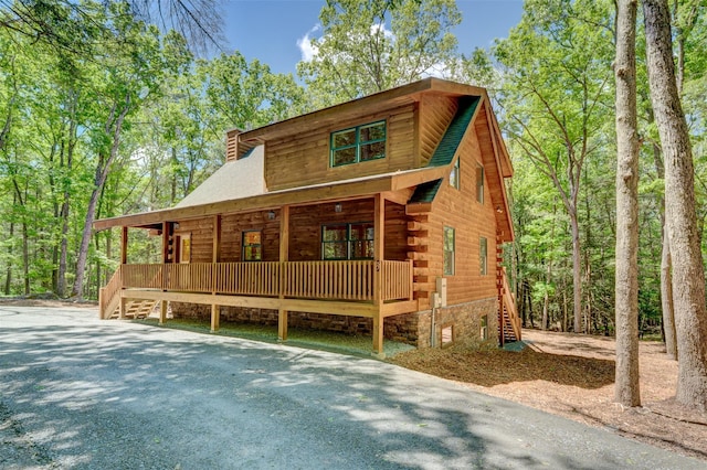 57 Zane Grey Way, Barryville, NY 12719 - log-style house with a porch, stairway, log exterior, and a chimney