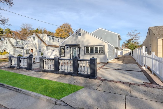 24 Commander Ave, Hempstead, NY 11550 - view of front facade featuring concrete driveway