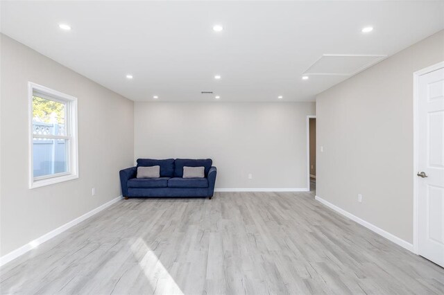 24 Commander Ave, Hempstead, NY 11550 - unfurnished room with attic access, light wood-style floors, recessed lighting, and baseboards