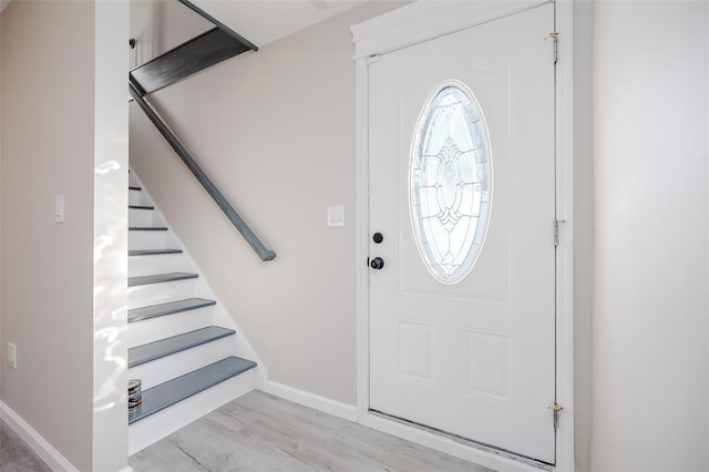 24 Commander Ave, Hempstead, NY 11550 - foyer with stairs, baseboards, and light wood-type flooring