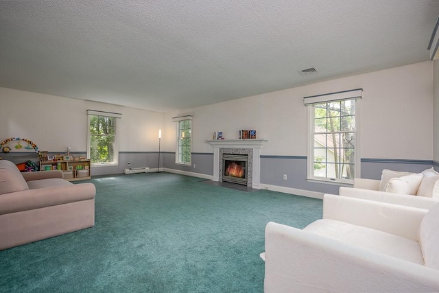 20 Hawk Nest Rd, Tomkins Cove, NY 10986 - carpeted living area featuring healthy amount of natural light, a fireplace with flush hearth, a textured ceiling, and baseboards