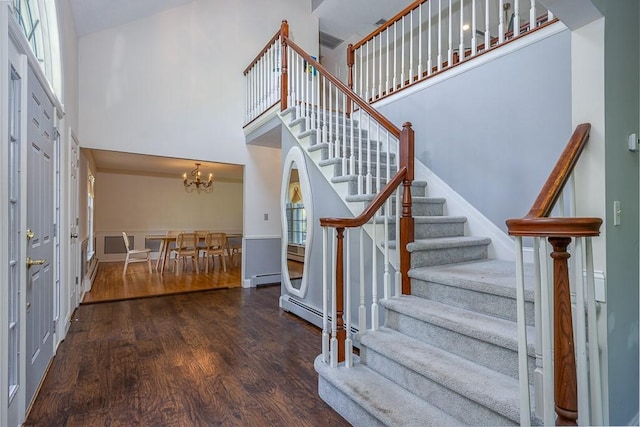20 Hawk Nest Rd, Tomkins Cove, NY 10986 - foyer entrance with wood finished floors, stairway, a towering ceiling, baseboard heating, and a chandelier