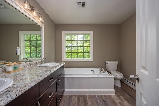 20 Hawk Nest Rd, Tomkins Cove, NY 10986 - full bathroom with baseboard heating, wood finished floors, toilet, and a bath
