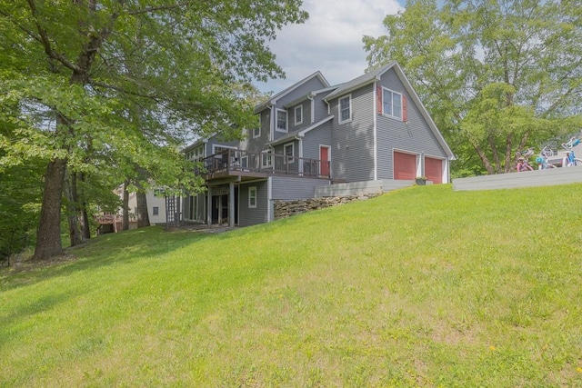 20 Hawk Nest Rd, Tomkins Cove, NY 10986 - back of property featuring a garage, a deck, and a lawn
