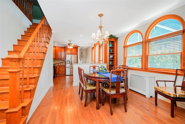 39 Summit Ave, Staten Island, NY 10306 - dining room featuring a chandelier, light wood finished floors, ornamental molding, recessed lighting, and radiator