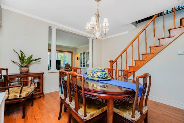 39 Summit Ave, Staten Island, NY 10306 - dining area with light wood finished floors, baseboards, stairs, ornate columns, and crown molding