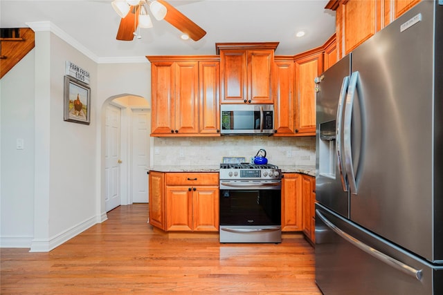 39 Summit Ave, Staten Island, NY 10306 - kitchen featuring stainless steel appliances, a ceiling fan, backsplash, light wood-type flooring, and baseboards