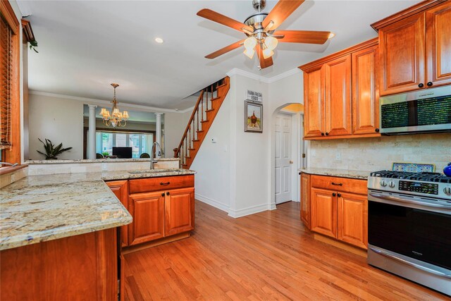 39 Summit Ave, Staten Island, NY 10306 - kitchen featuring appliances with stainless steel finishes, a sink, baseboards, a chandelier, and tasteful backsplash