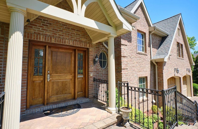 23 Tanners Rd, Great Neck, NY 11020 - entrance to property with brick siding and roof with shingles