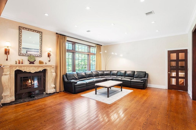 23 Tanners Rd, Great Neck, NY 11020 - living room featuring wood finished floors, ornamental molding, a premium fireplace, recessed lighting, and baseboards