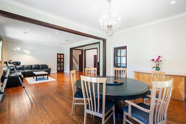 23 Tanners Rd, Great Neck, NY 11020 - dining area featuring stairway, wood finished floors, a chandelier, recessed lighting, and crown molding