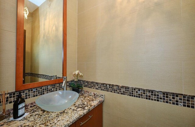 23 Tanners Rd, Great Neck, NY 11020 - bathroom with vanity and tasteful backsplash
