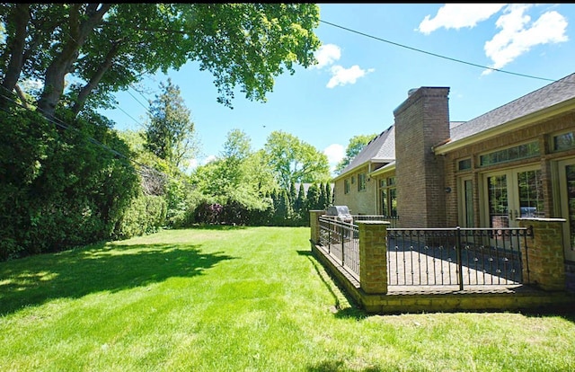 23 Tanners Rd, Great Neck, NY 11020 - view of grassy yard with a patio