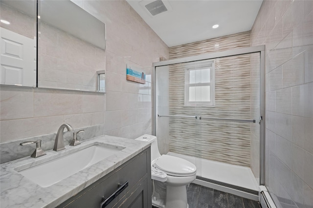 15 Salem Rd, Hicksville, NY 11801 - full bath with tile walls, a stall shower, vanity, wood finished floors, and a baseboard heating unit