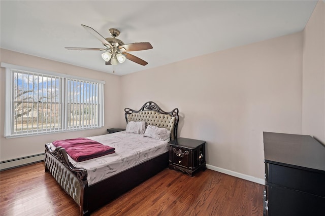 15 Salem Rd, Hicksville, NY 11801 - bedroom with a baseboard radiator, wood finished floors, and a ceiling fan