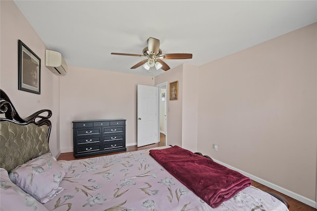 15 Salem Rd, Hicksville, NY 11801 - bedroom featuring a wall mounted air conditioner, wood finished floors, and a ceiling fan