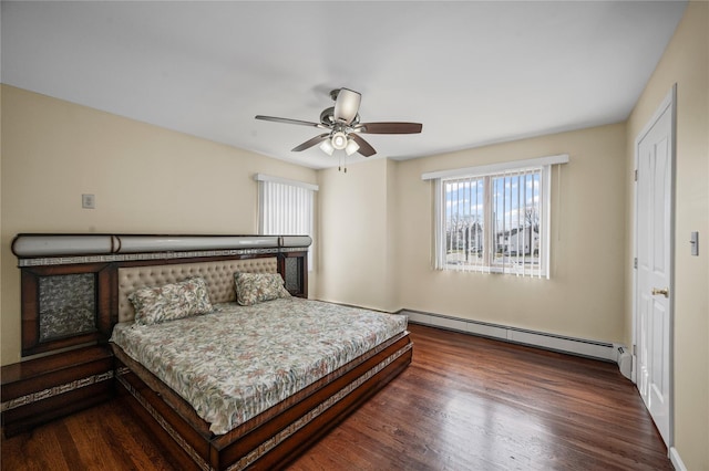 15 Salem Rd, Hicksville, NY 11801 - bedroom featuring a baseboard heating unit, multiple windows, wood finished floors, and a ceiling fan
