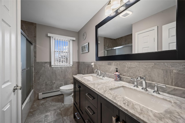 15 Salem Rd, Hicksville, NY 11801 - full bathroom with baseboard heating, tile walls, double vanity, enclosed tub / shower combo, and marble finish flooring