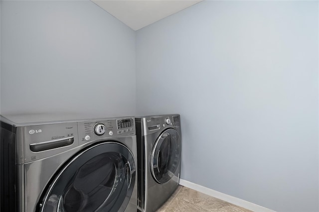15 Salem Rd, Hicksville, NY 11801 - washroom featuring washing machine and dryer and tile patterned flooring