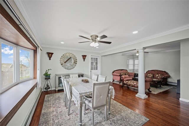 15 Salem Rd, Hicksville, NY 11801 - dining area featuring decorative columns, dark wood finished floors, baseboard heating, a ceiling fan, and crown molding
