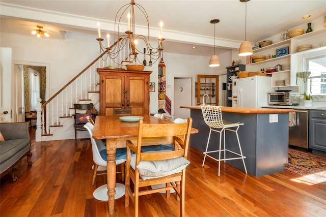 336 County Highway 5, Bovina Center, NY 13740 - dining room with dark wood finished floors, stairway, and a chandelier