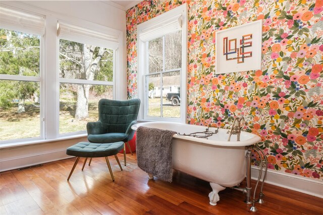 336 County Highway 5, Bovina Center, NY 13740 - sitting room featuring wallpapered walls, healthy amount of natural light, wood finished floors, and baseboards
