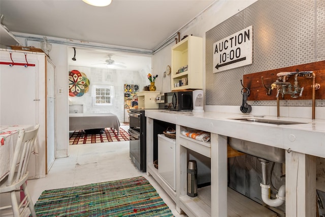 336 County Highway 5, Bovina Center, NY 13740 - kitchen with ceiling fan, open shelves, range with two ovens, a sink, and light countertops