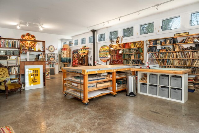 336 County Highway 5, Bovina Center, NY 13740 - misc room featuring track lighting, finished concrete flooring, and a workshop area