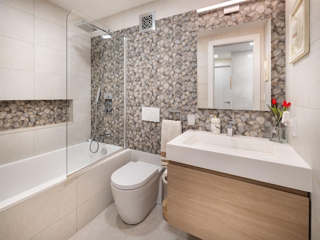 25-40 Shore Blvd Unit 17K, Astoria, NY 11102 - bathroom with tiled shower / bath, vanity, toilet, tile walls, and tile patterned flooring