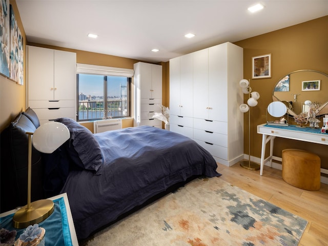 25-40 Shore Blvd Unit 17K, Astoria, NY 11102 - bedroom with light wood-style flooring, baseboards, and recessed lighting