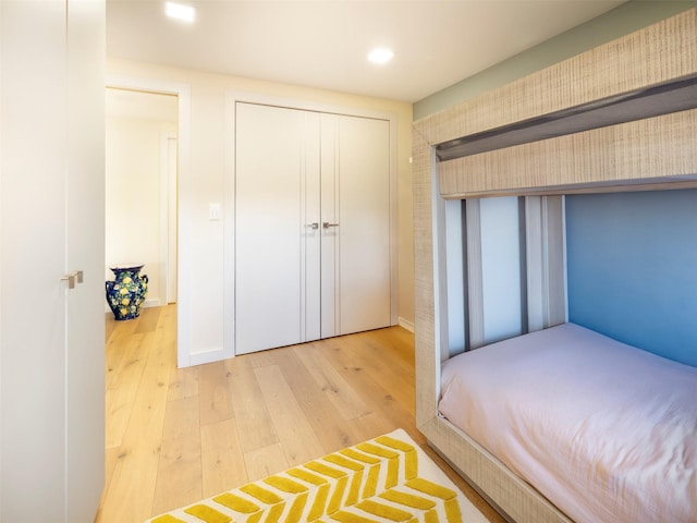 25-40 Shore Blvd Unit 17K, Astoria, NY 11102 - unfurnished bedroom with wood-type flooring, recessed lighting, and a closet