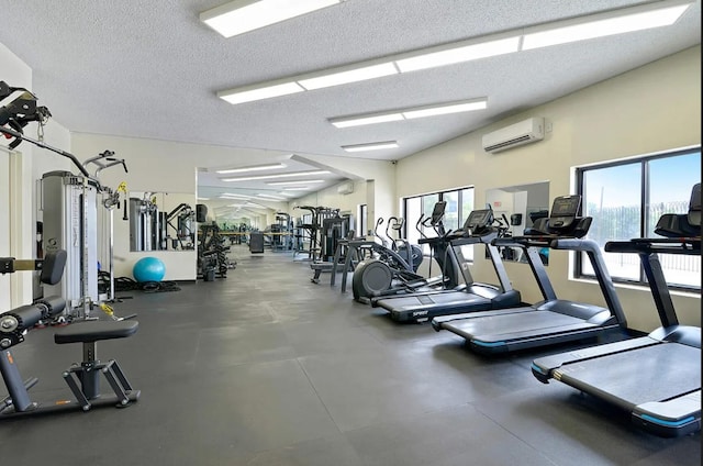 25-40 Shore Blvd Unit 17K, Astoria, NY 11102 - gym with plenty of natural light, a wall unit AC, and a textured ceiling